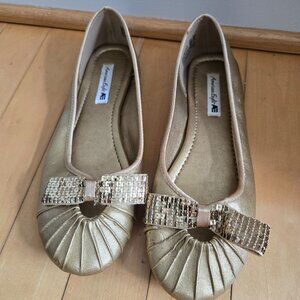 Gold American Eagle flats